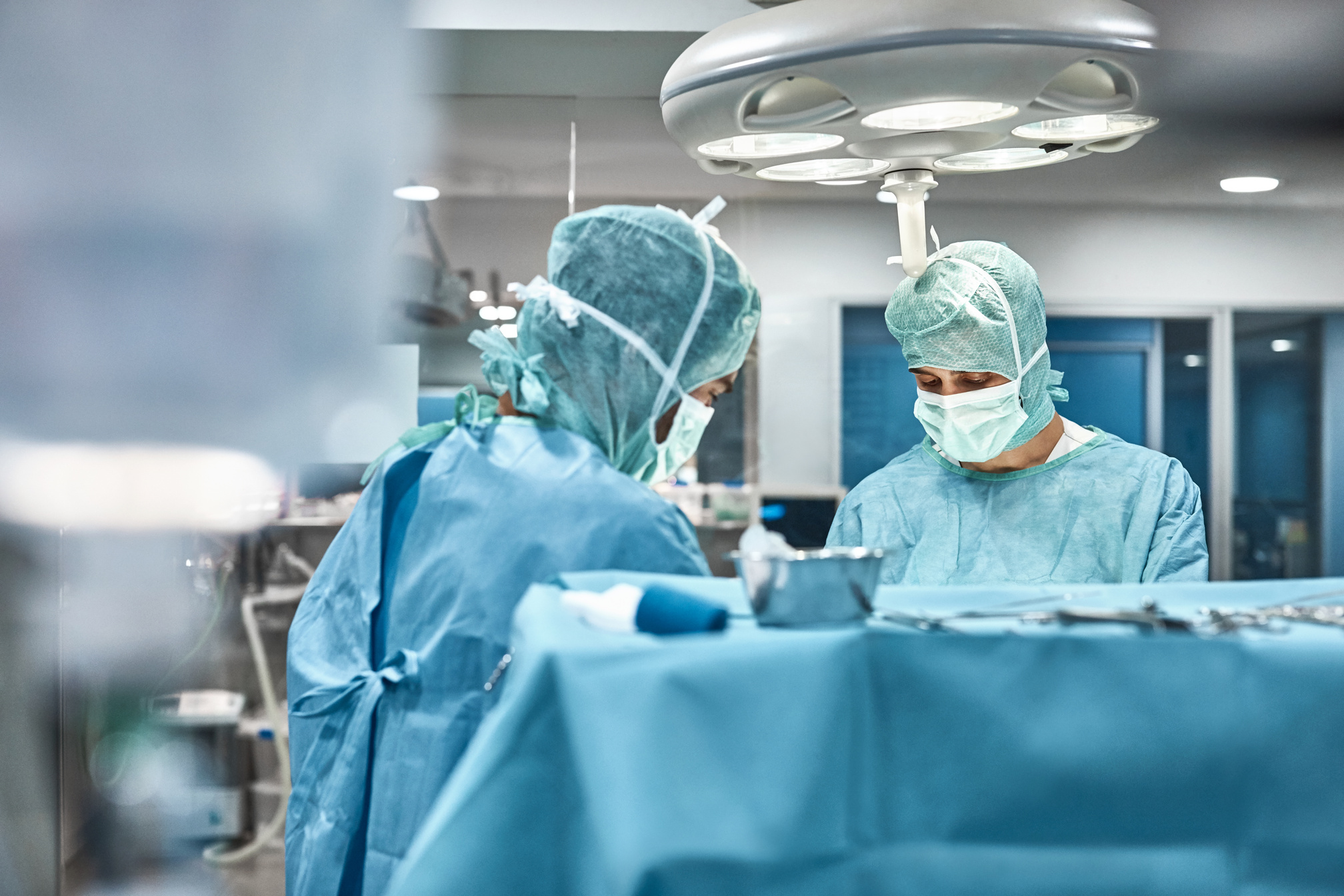 Veterinary surgeons performing surgery in hospital